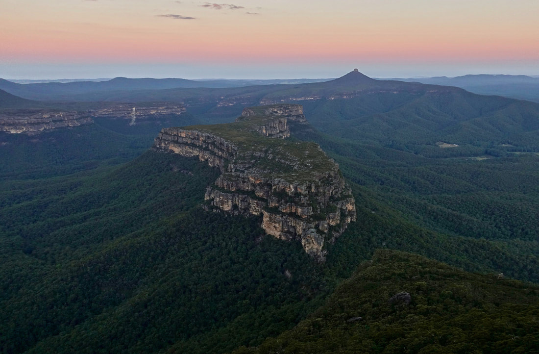 Pigeon House and Byangee Mountain from the Castle at sunset in the Budawangs in Australia