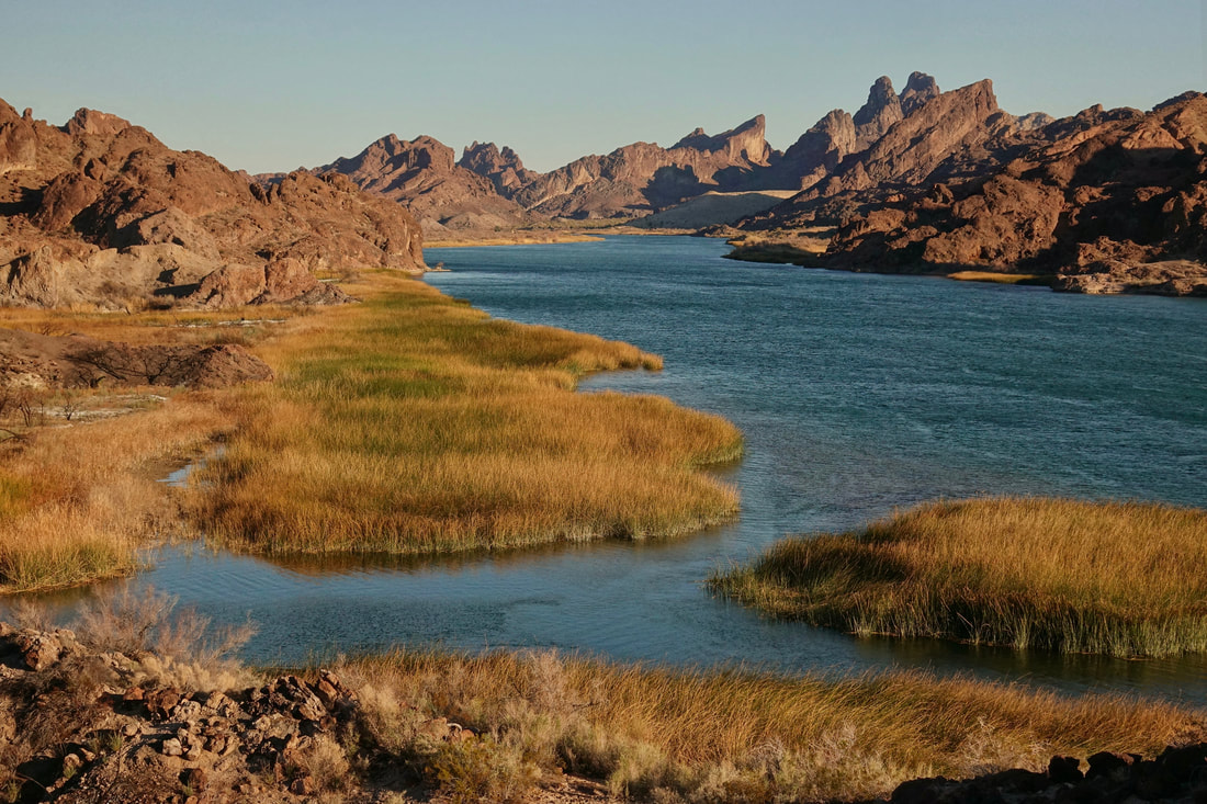 Colorado River with the Needles Mountains in view across the river in the Havasu Wilderness